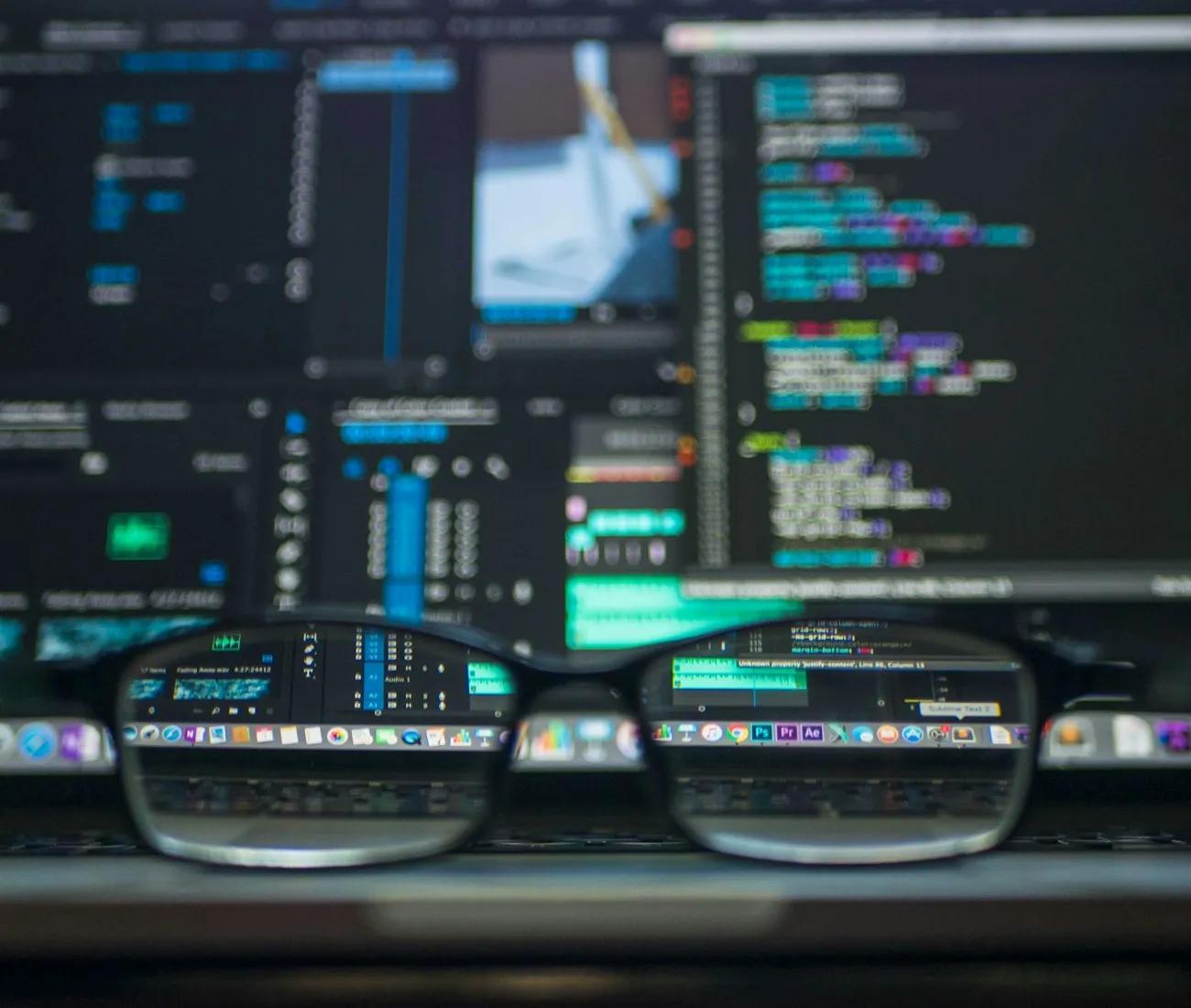 Developer writing code on a laptop